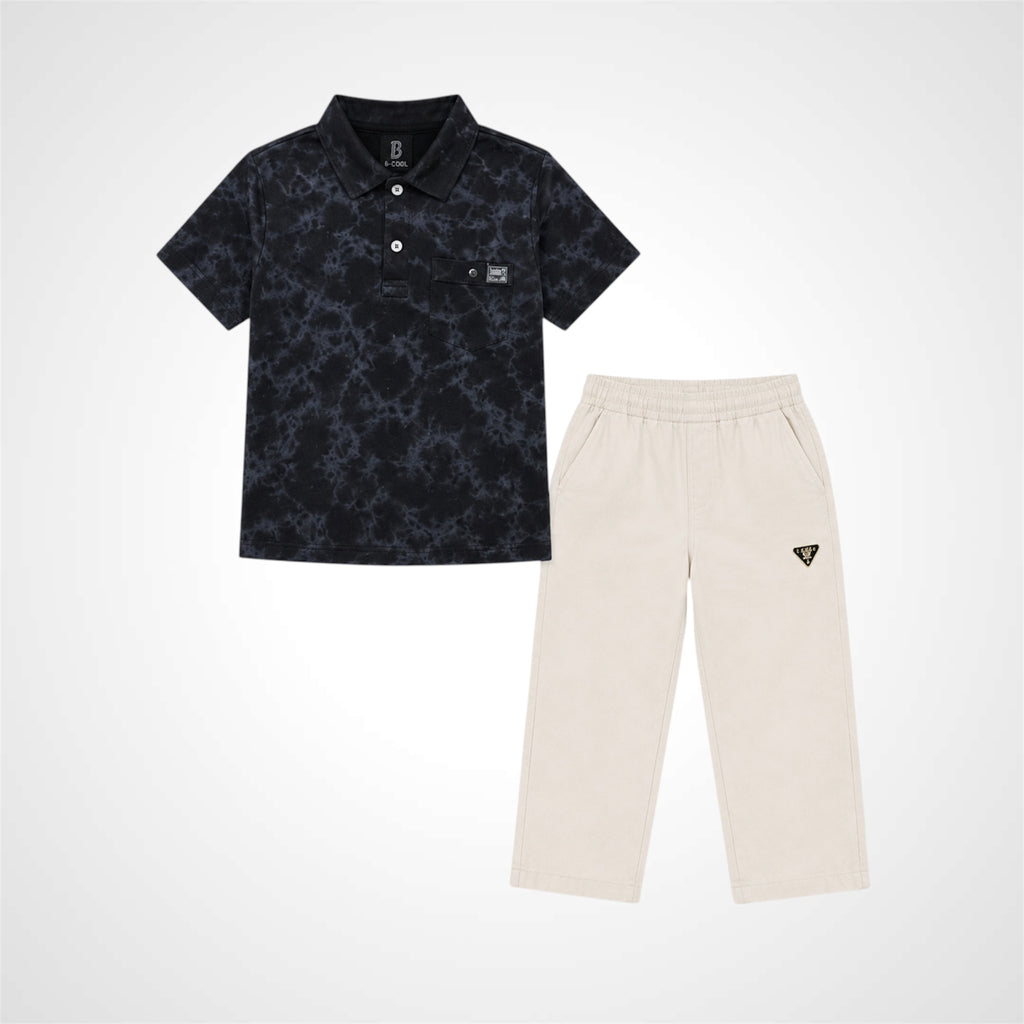 A two-piece kids' outfit set featuring a short-sleeve polo shirt in black with a subtle gray abstract pattern, paired with cream-colored pants that have a small black triangular logo on the left thigh.
