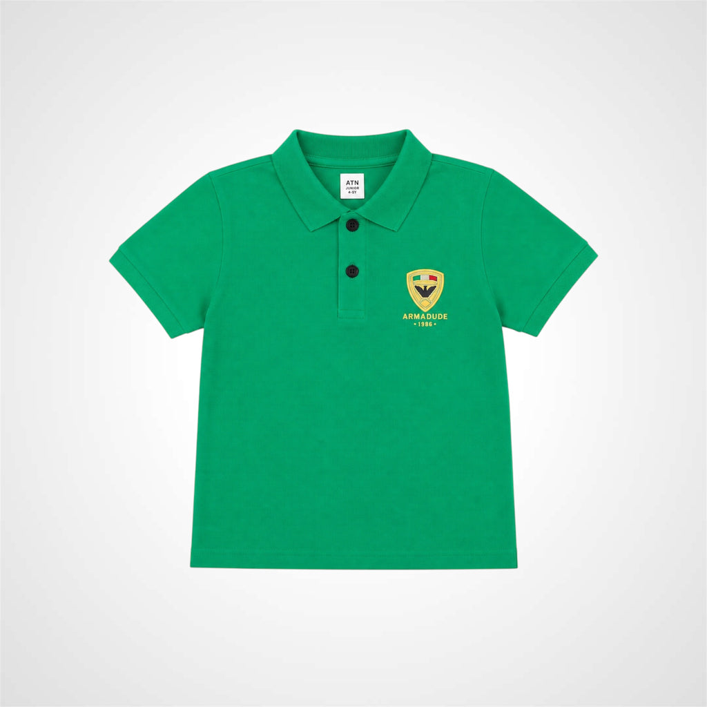 A green short-sleeve polo shirt for children, featuring a two-button placket and a yellow and black Abergide 1925 crest embroidered on the left chest, displayed on a light gray background.