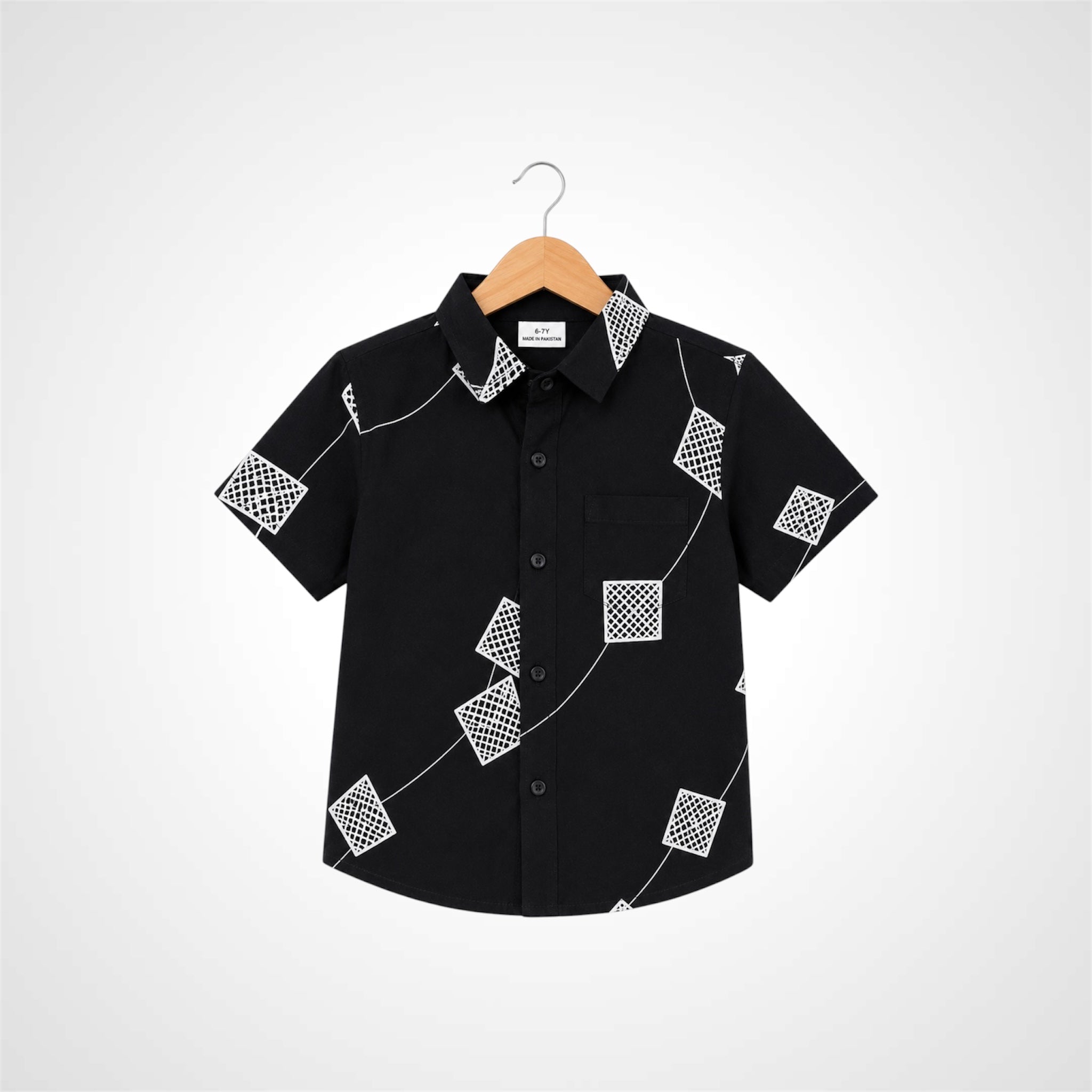 A black short-sleeve button-up shirt with a white geometric pattern of squares and lines, hanging on a wooden hanger against a light gray background.