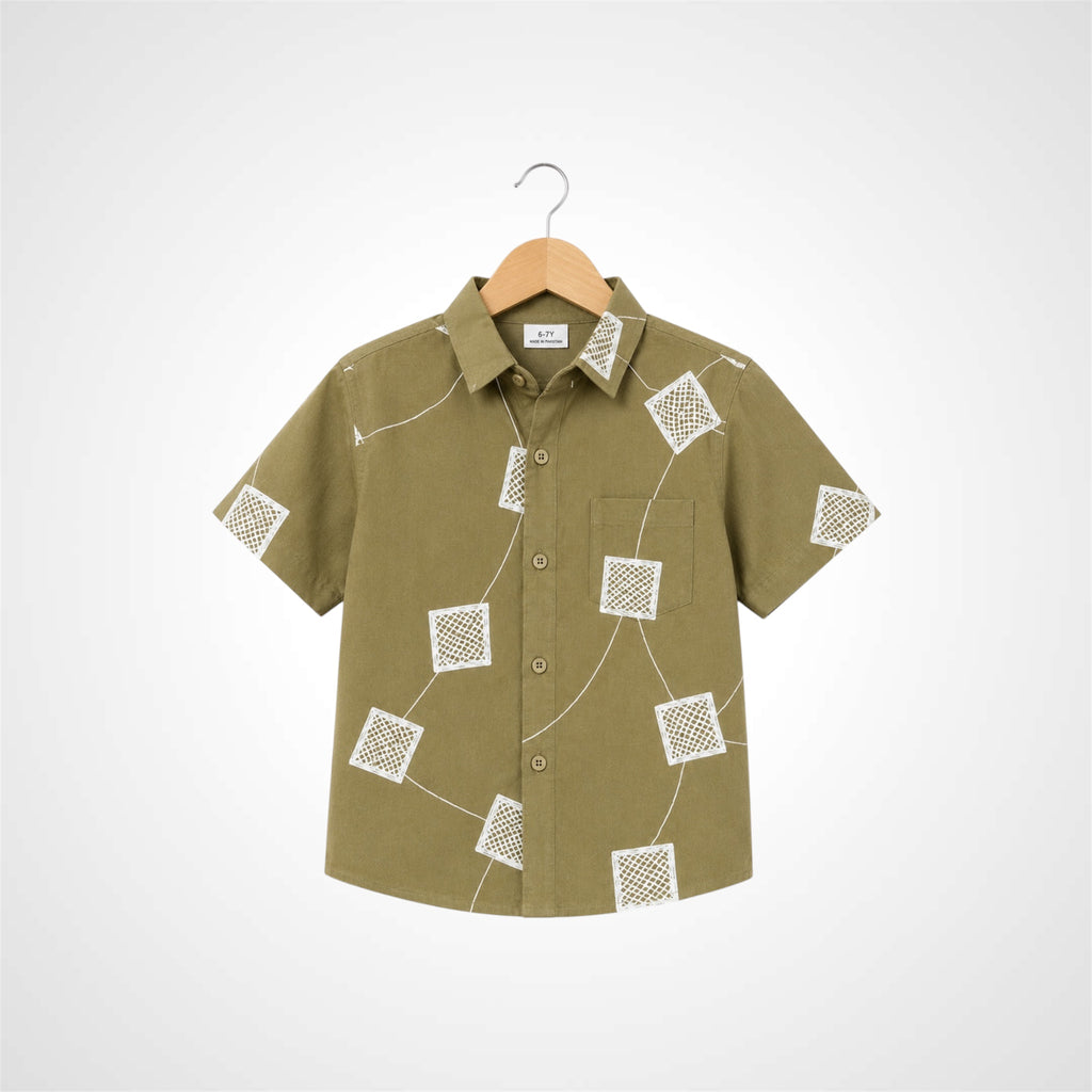 A short-sleeve button-up shirt in olive green with a white geometric line pattern, hanging on a wooden hanger against a light gray background.