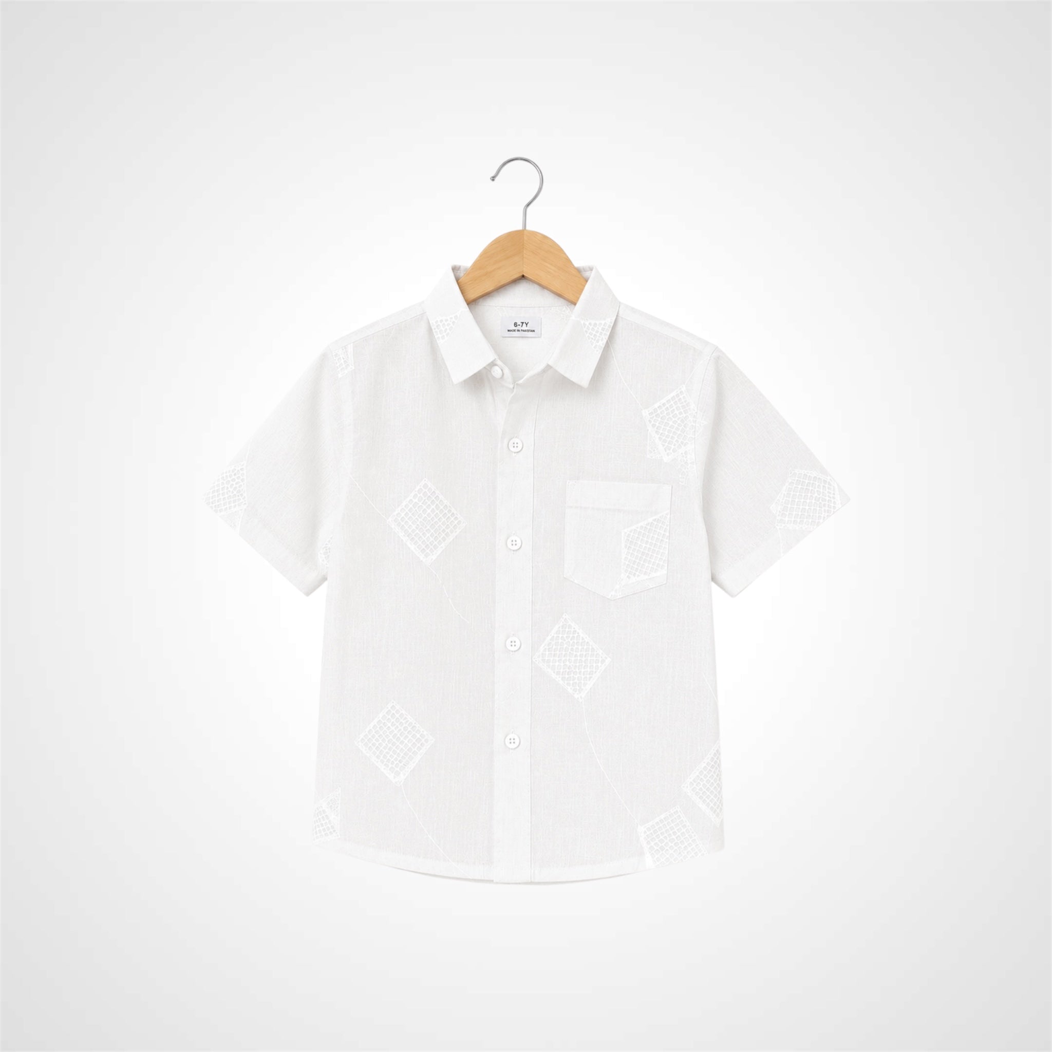 A white short-sleeve button-up shirt with a subtle tonal geometric pattern, displayed on a wooden hanger against a light gray gradient background.