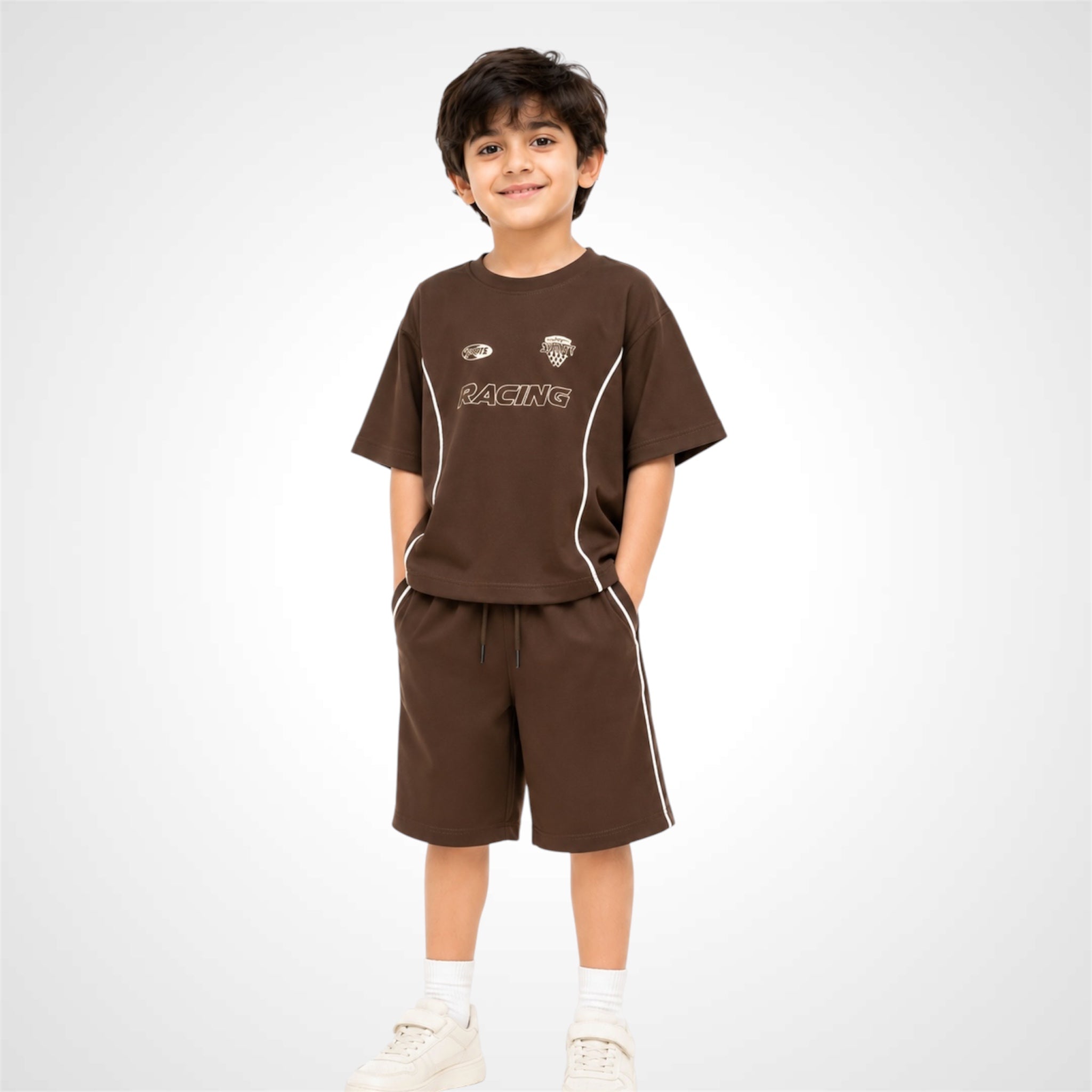 Child wearing a brown 'RACING' t-shirt and shorts on a white background