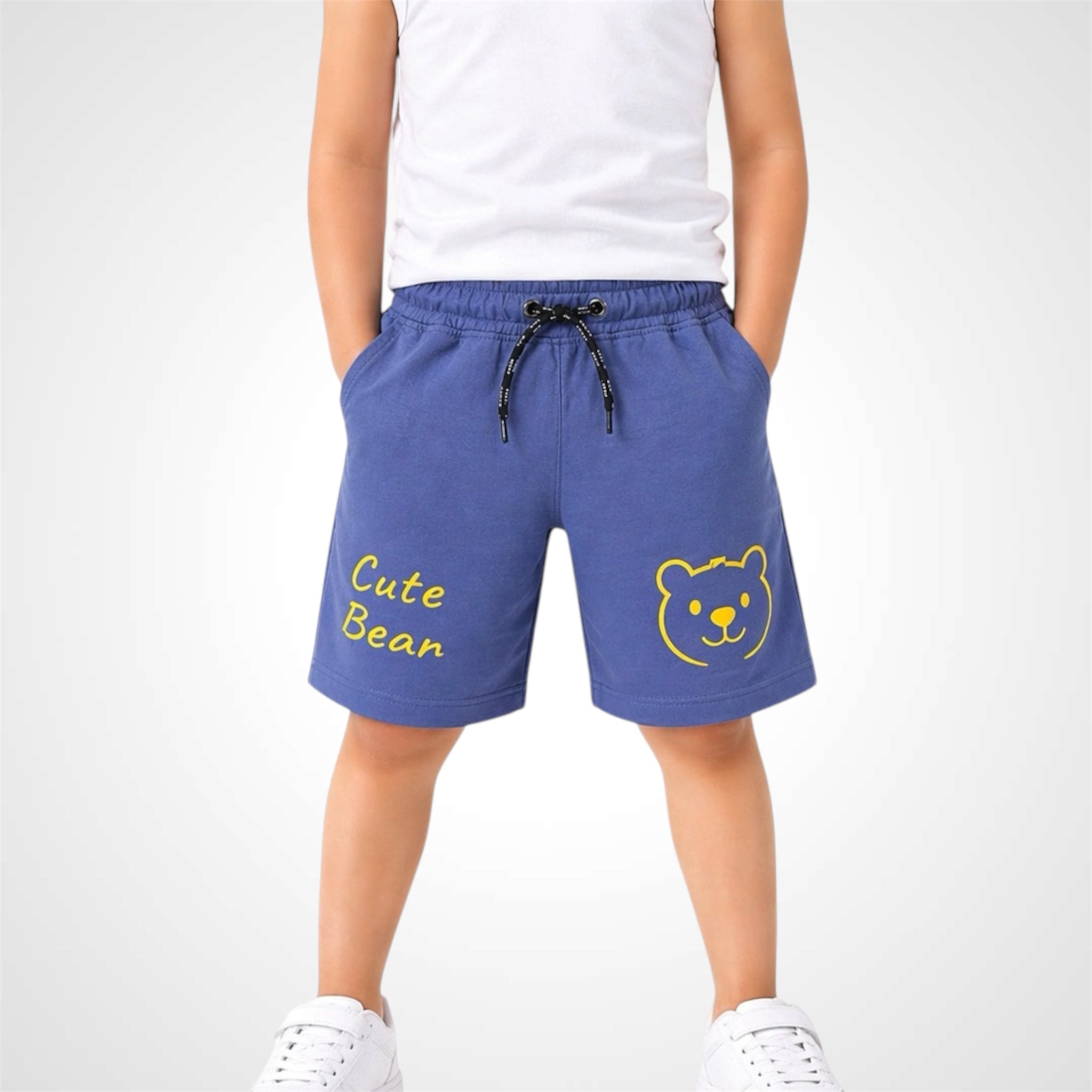 Blue shorts with a bear design and 'Cute Bear' text worn by a person on a white background