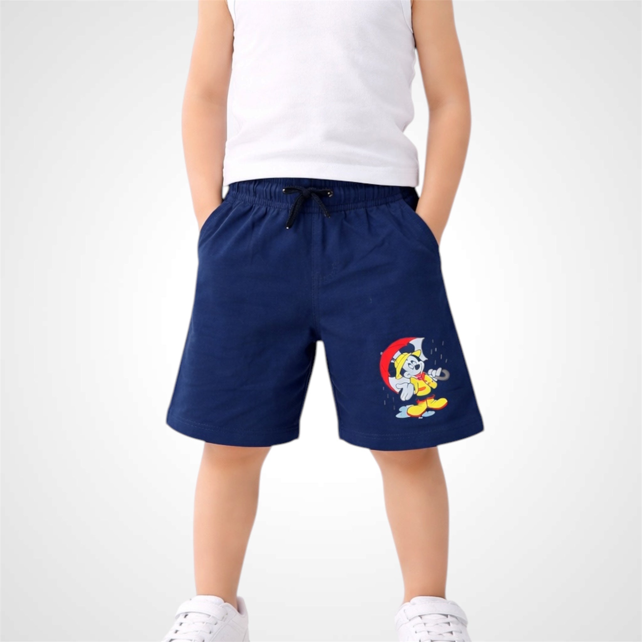 Person wearing navy shorts with a cartoon character on a white background