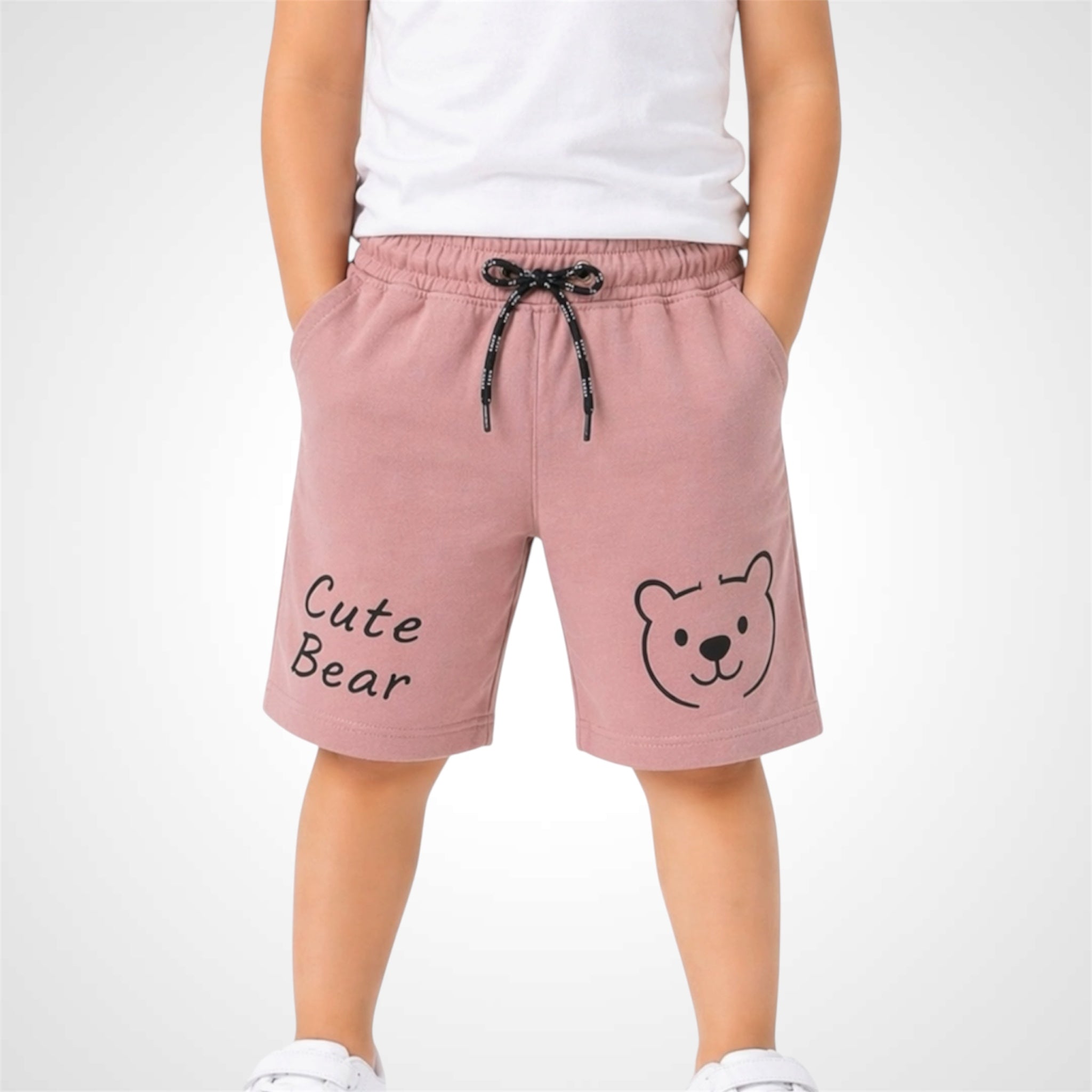 Pink shorts with a bear design and text on a white background