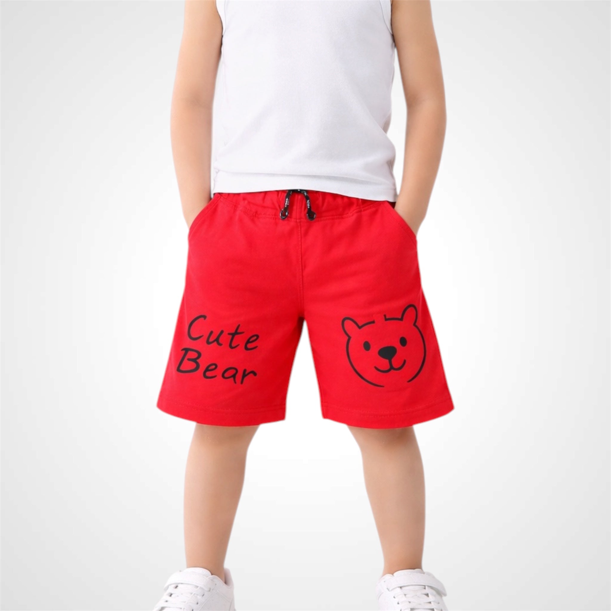 Red shorts with 'Cute Bear' text and bear graphic worn by a person on a white background