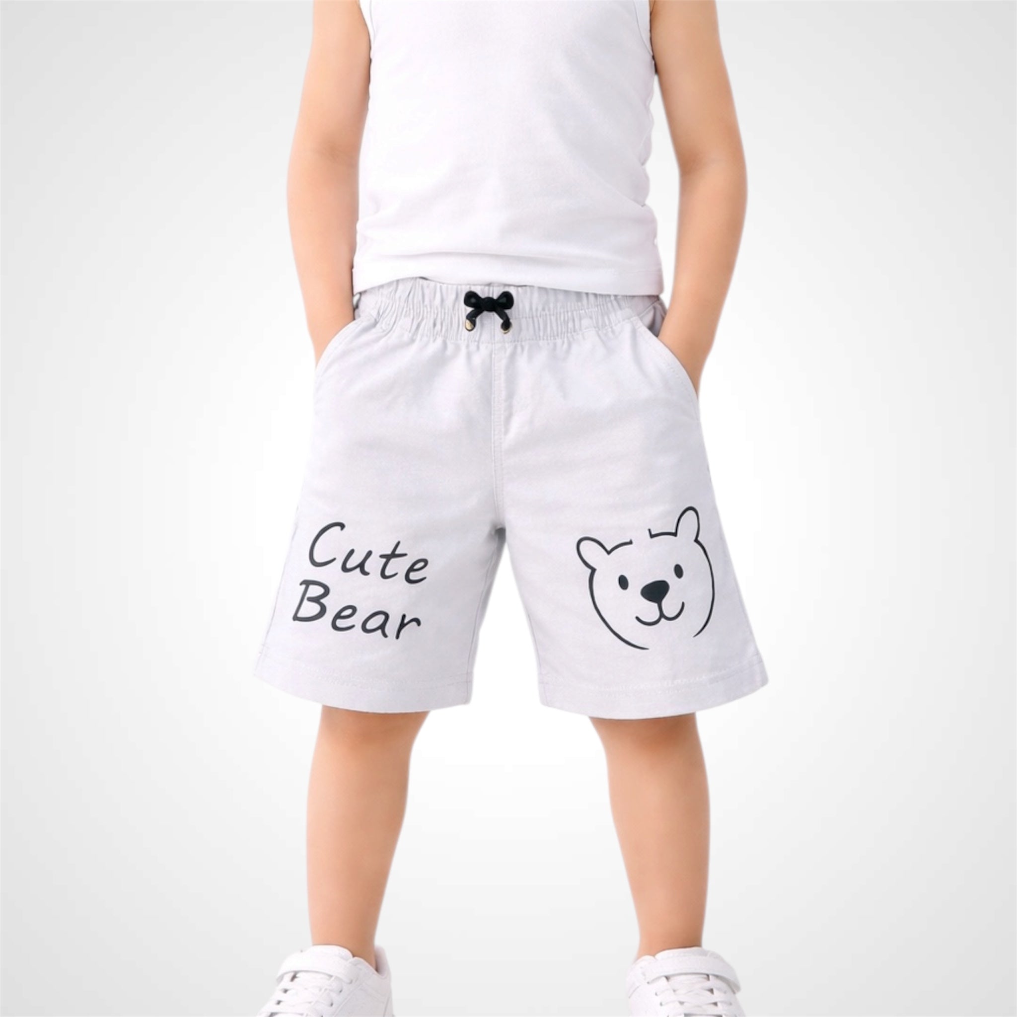 White shorts with 'Cute Bear' text and bear graphic worn by a person on a white background