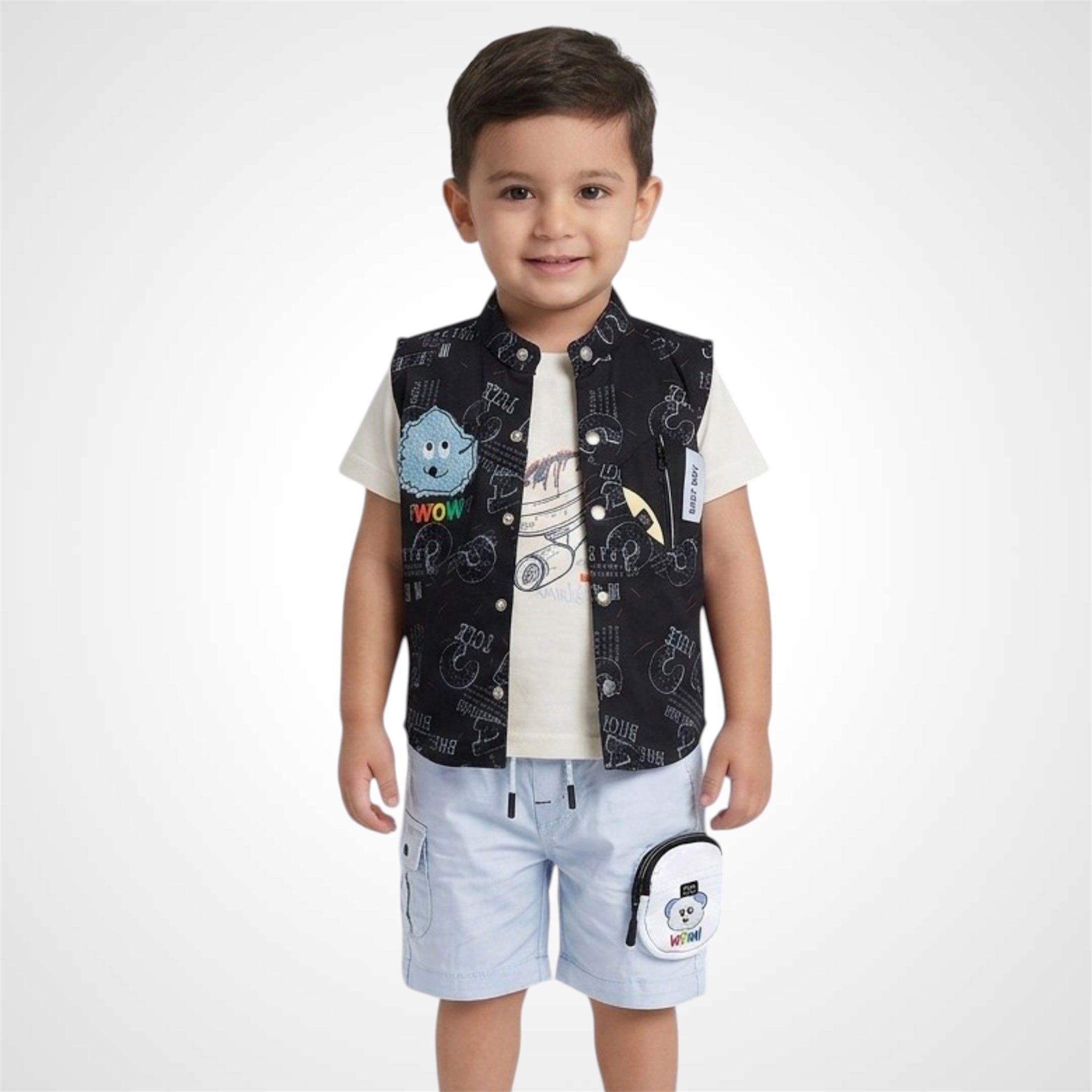 Child wearing a black patterned vest with cartoon characters on a white background