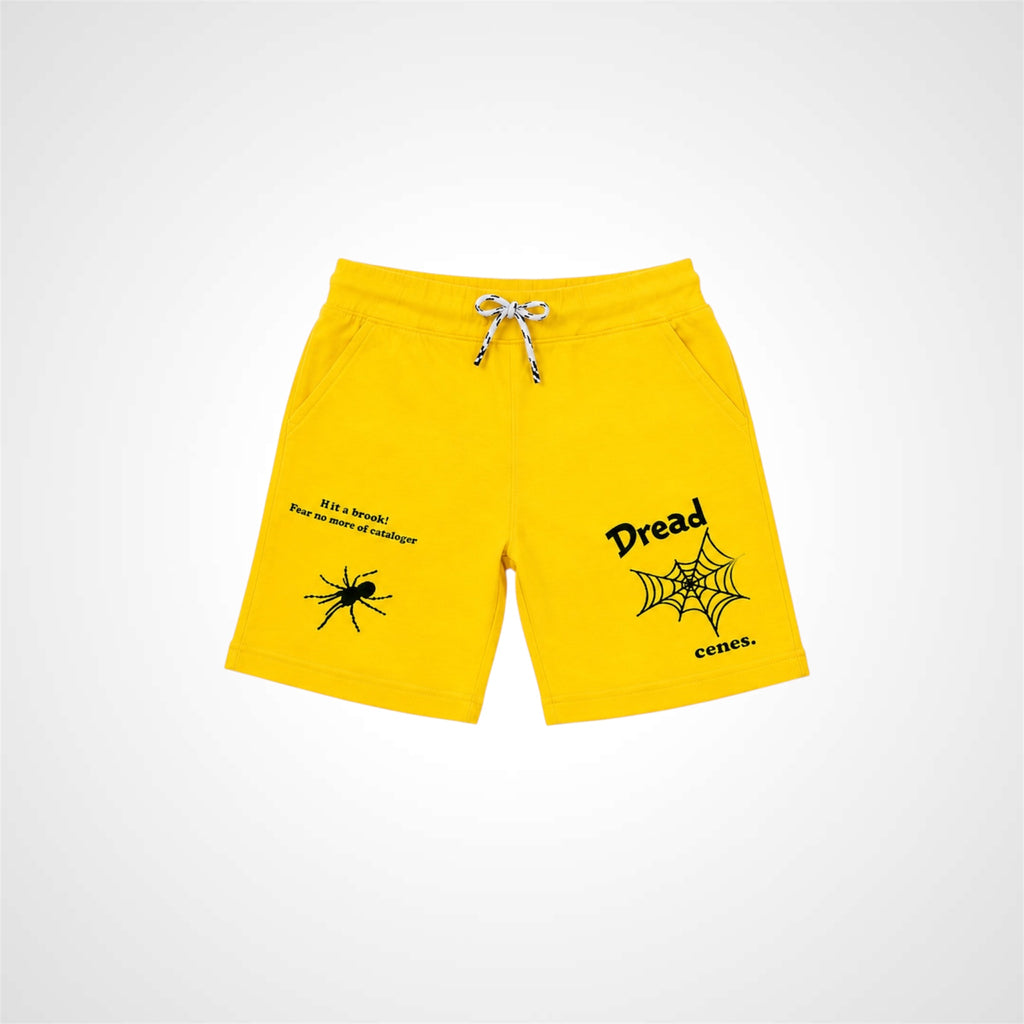 Yellow shorts with spider and web design on a white background