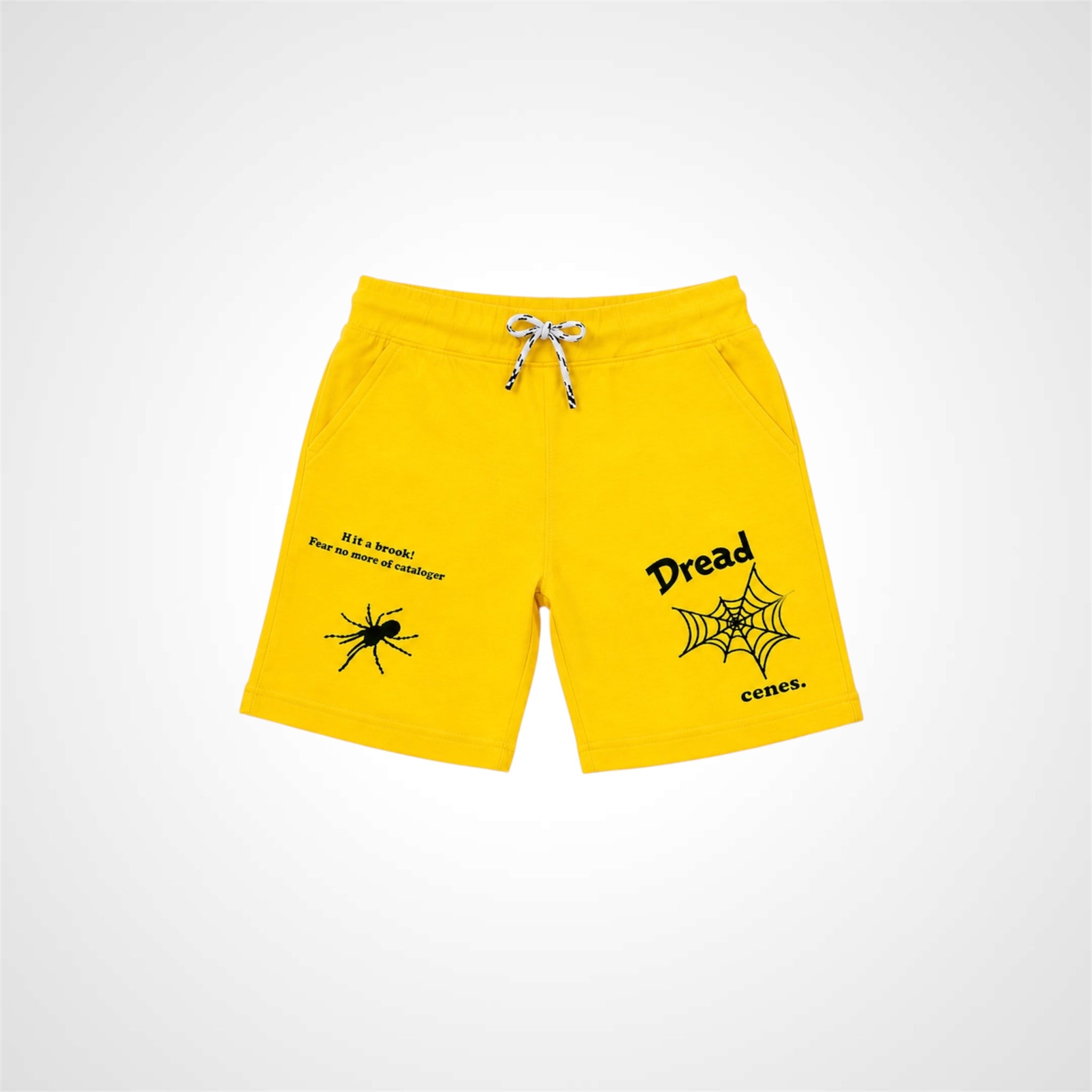 Yellow shorts with spider and web design on a white background