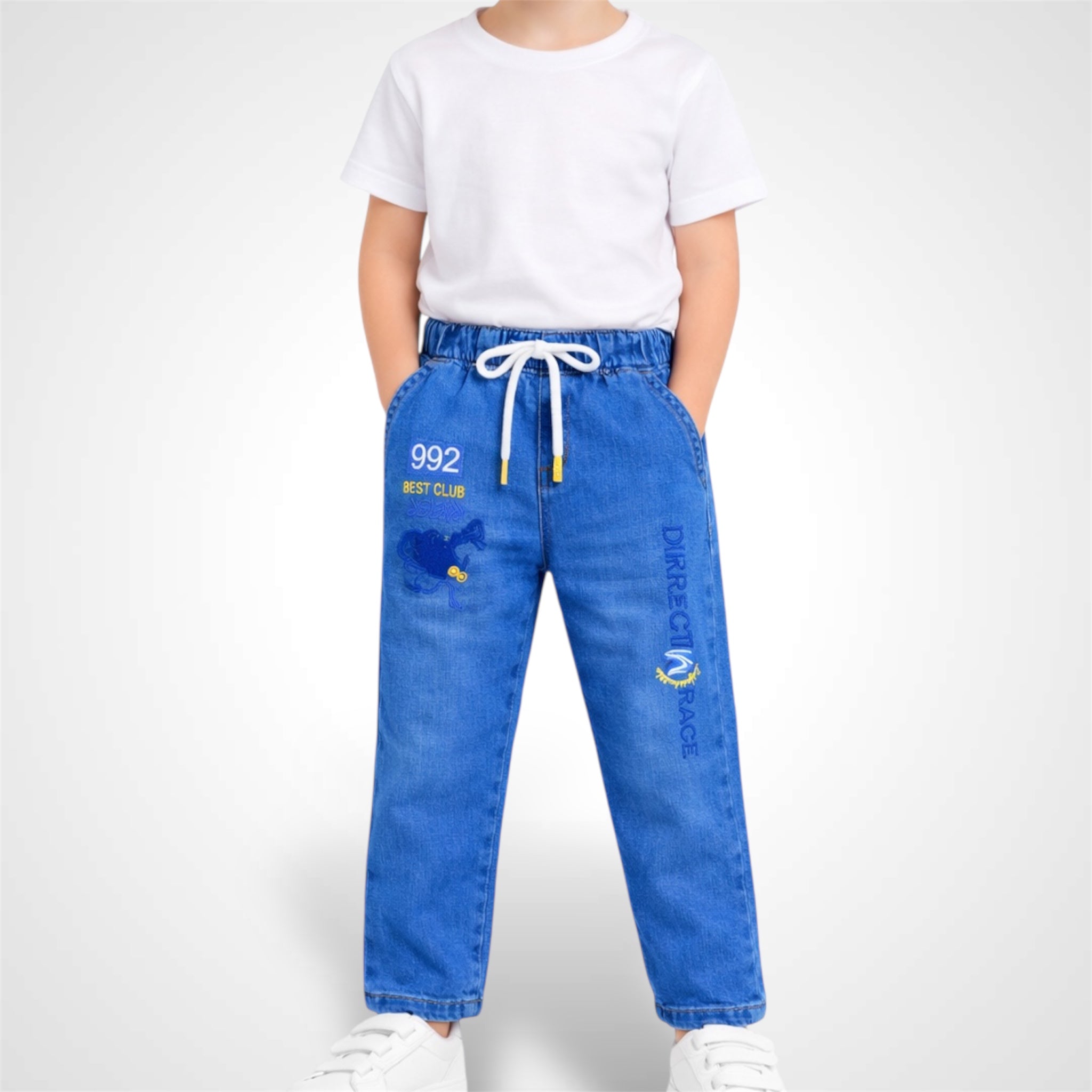 Kids comfort-fit denim joggers with adjustable drawstring waist and graphic embroidery.