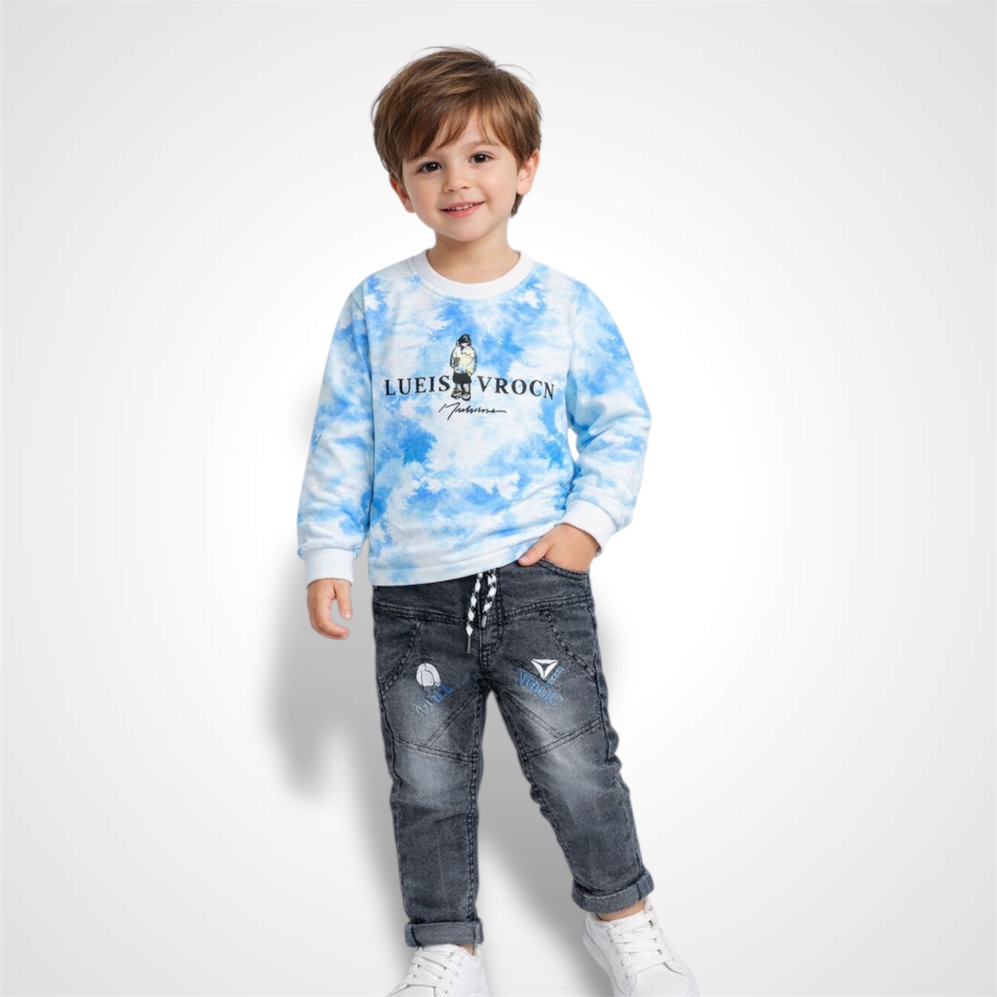 Close-up of a kids' trendy tie-dye sweatshirt and denim-style jogger set with high-quality stitching.