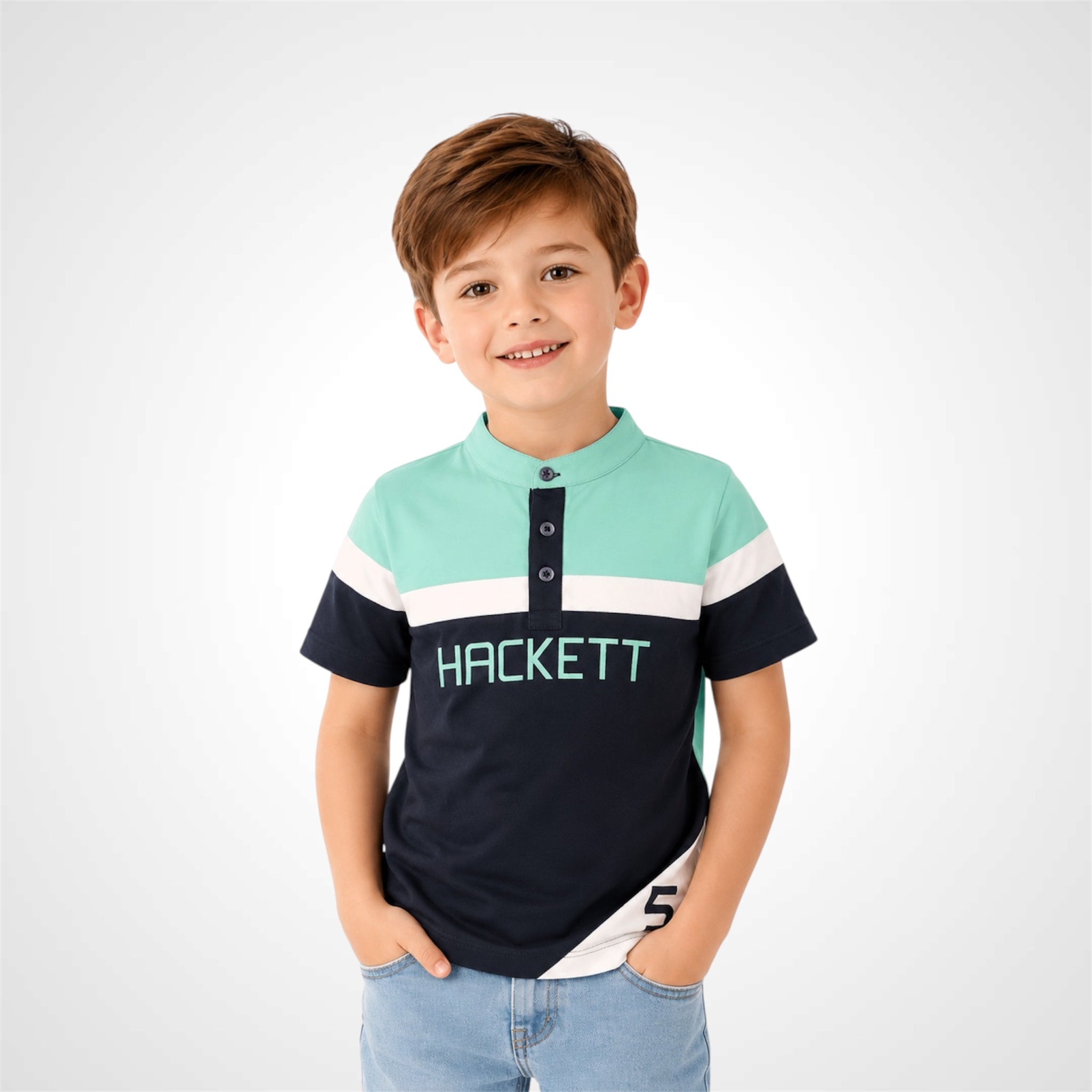 Young boy wearing a stylish Henley neck branded graphic t-shirt