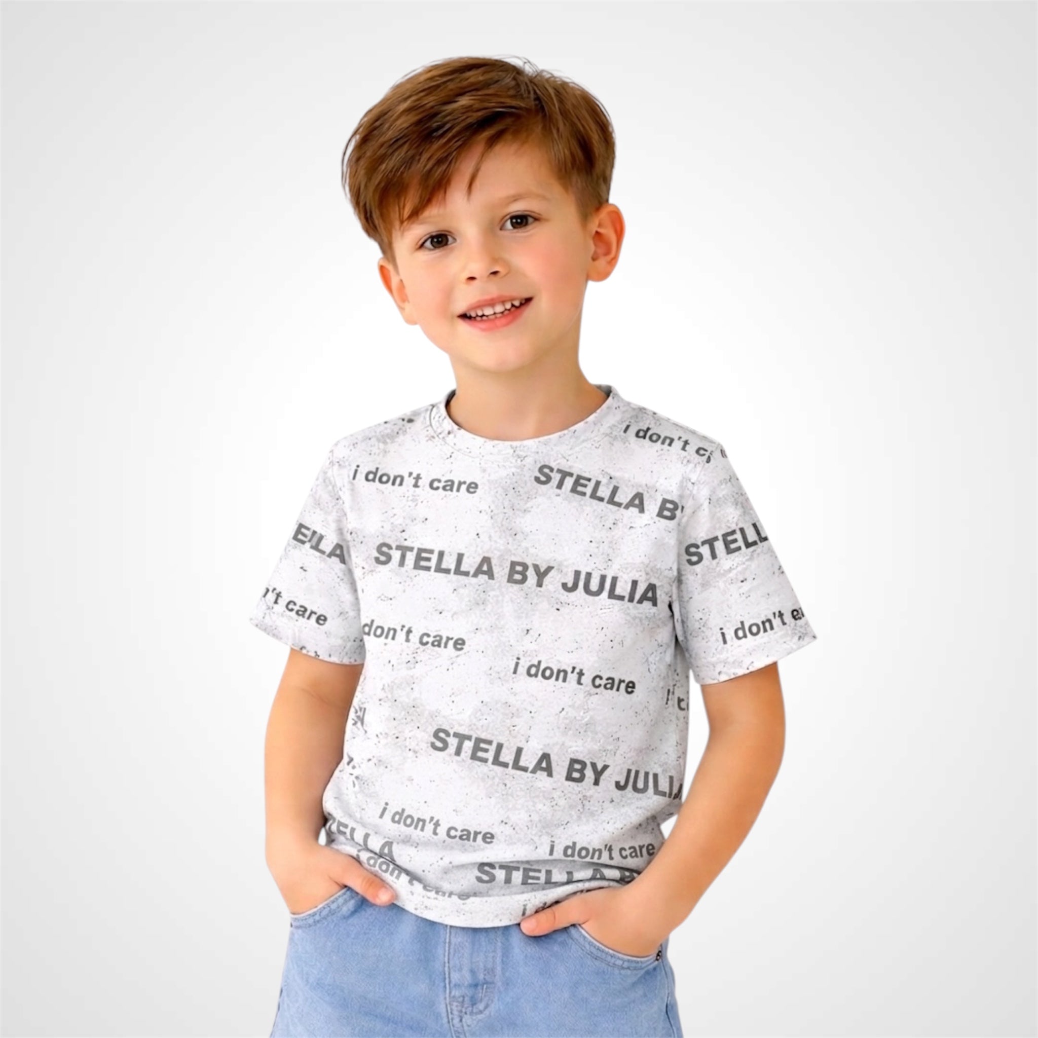 Child wearing a white t-shirt with text and 'Stella by Julia' branding on a white background