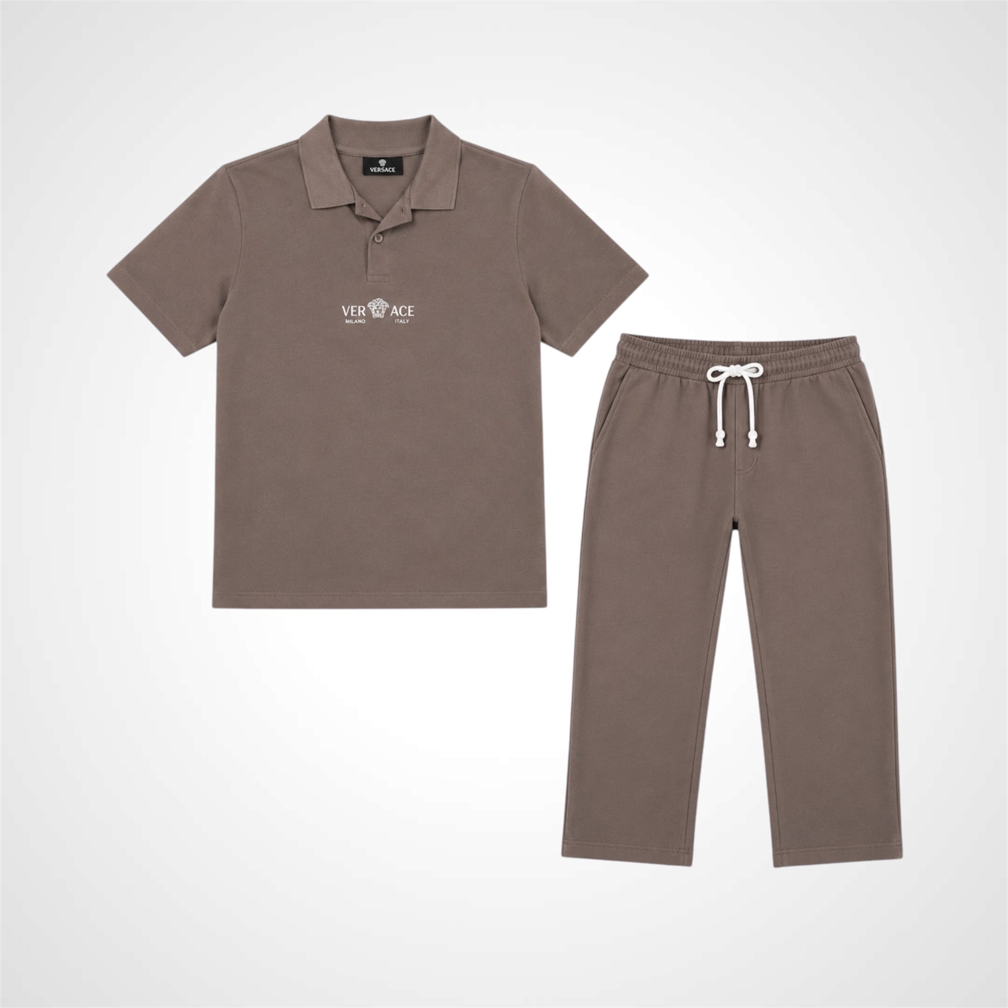 A two-piece kids' clothing set in a muted taupe-brown color, featuring a short-sleeve polo shirt with a white Versace logo on the chest and matching drawstring sweatpants, displayed on a clean white background.