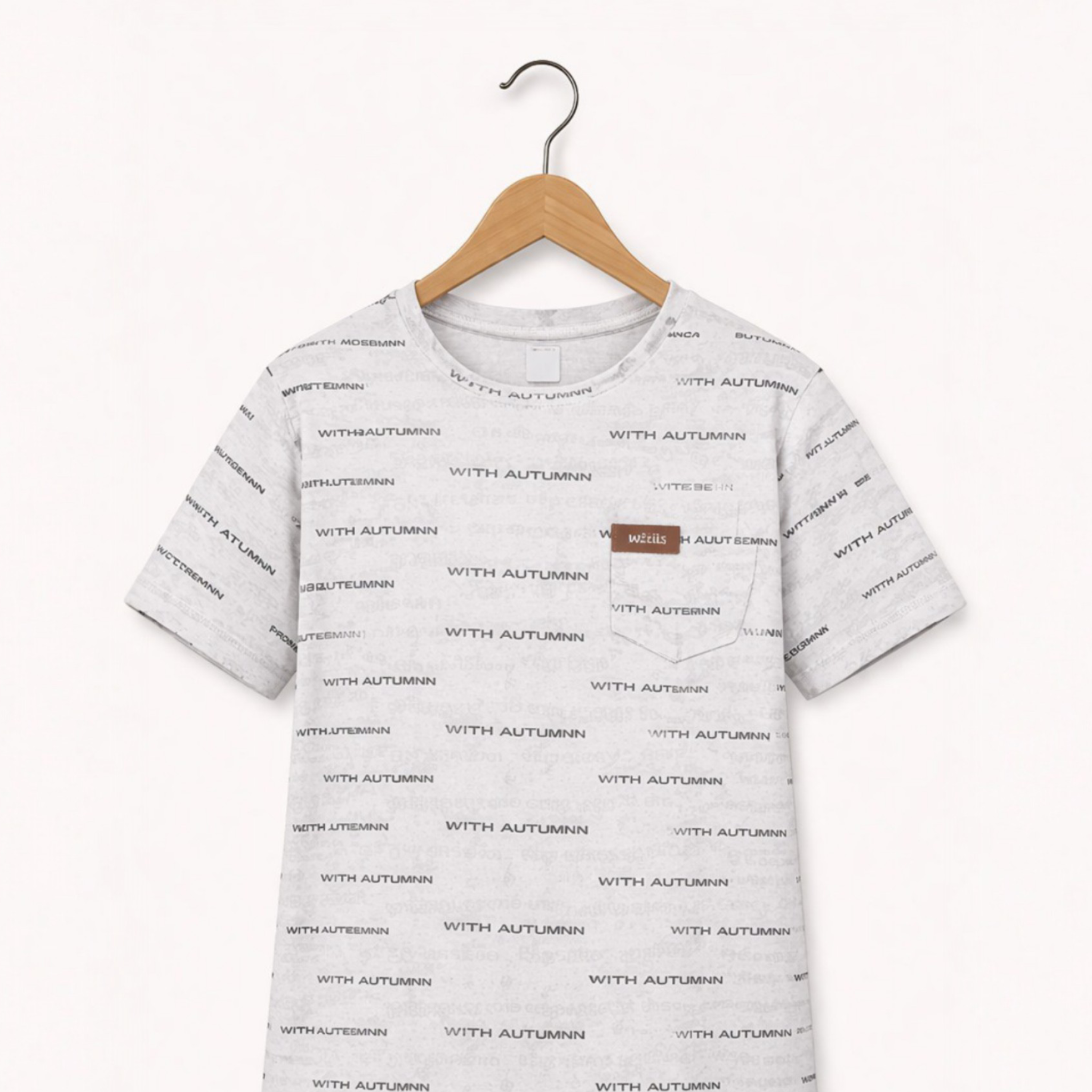 Gray t-shirt with text pattern on a hanger against a white background