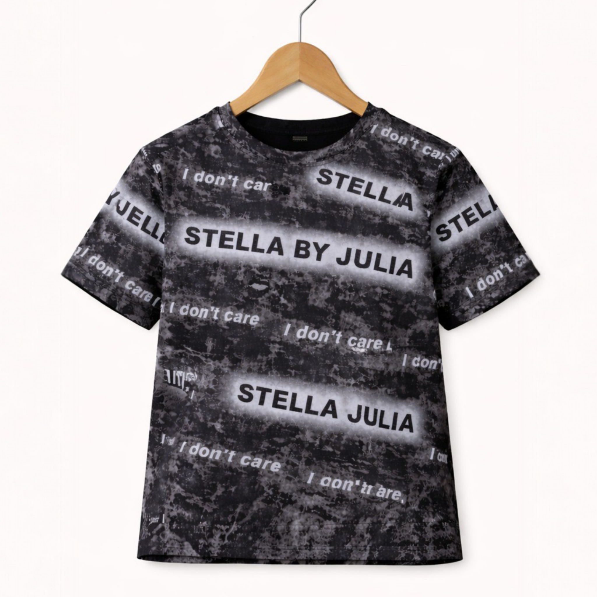 Black t-shirt with text design on a hanger against a white background